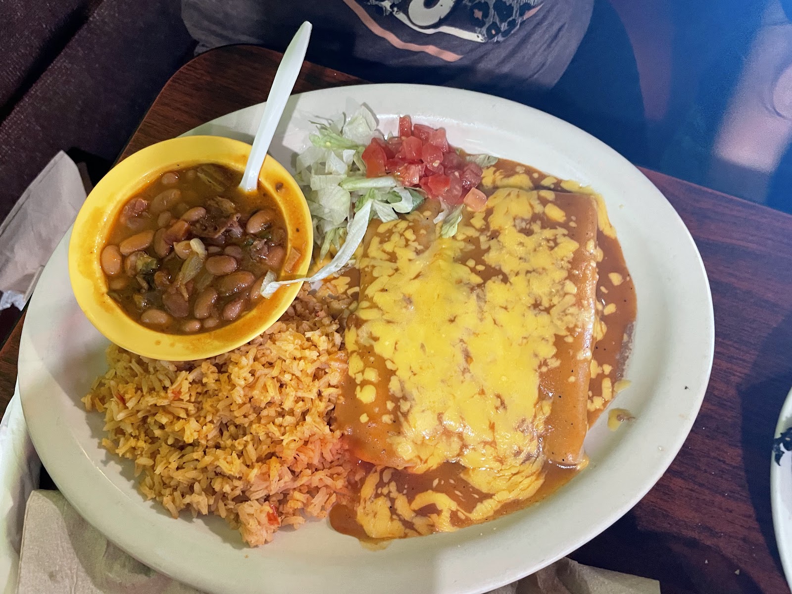 Enchilada plate with rice, beans, lettuce and tomato at The Palms Taqueria
