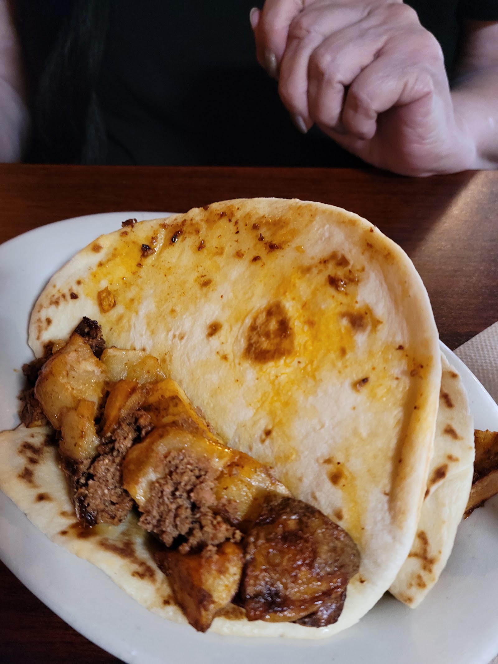 Grilled taco filled with beef and potato